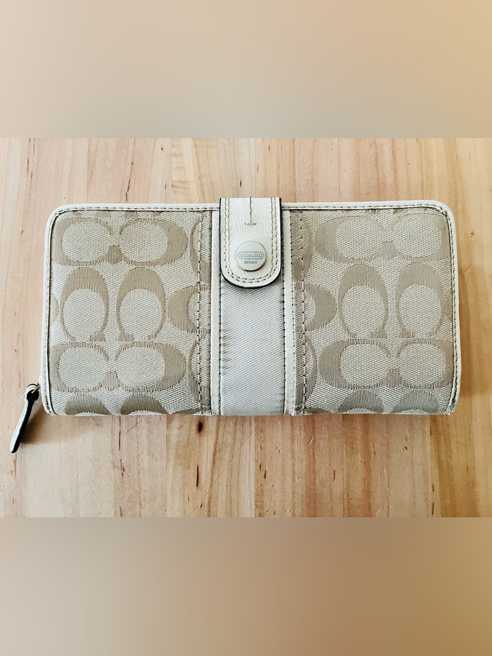 Coach Signature Monogram Wallet crafted in a classic khaki/beige jacquard